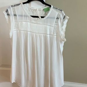 Pretty lace top with tie back. Dry cleaned recently.